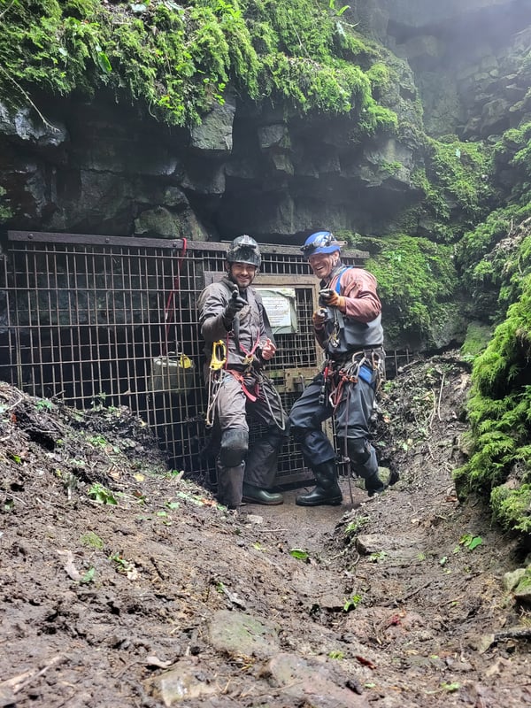 Cavers sttop outside the Wetsink entrance to Slaughter Stream Cave after completing the first ever long round trip
